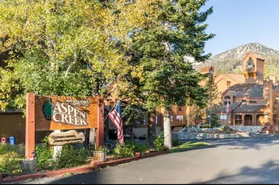 a sign for a sun center in front of a house at Aspen Creek 230 in Mammoth Lakes