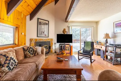 a living room with a couch and a table at Mammoth View Villas 39 in Mammoth Lakes