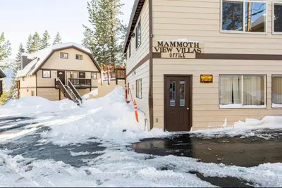 a building with snow in front of it at Mammoth View Villas 39 in Mammoth Lakes