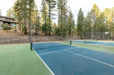 a tennis court with two tennis courts at Viewpoint 151 in Mammoth Lakes