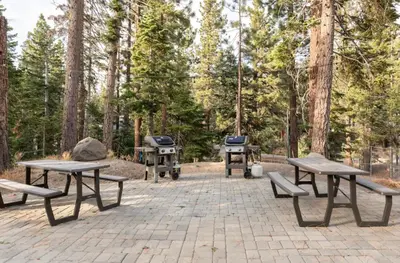 a picnic area with picnic tables and a grill at Viewpoint 151 in Mammoth Lakes