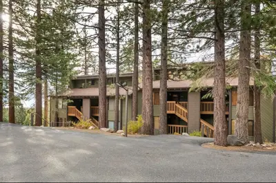 a large house with trees in front of it at Viewpoint 151 in Mammoth Lakes