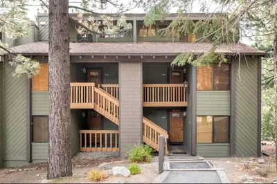 a house with a deck and a staircase at Viewpoint 151 in Mammoth Lakes