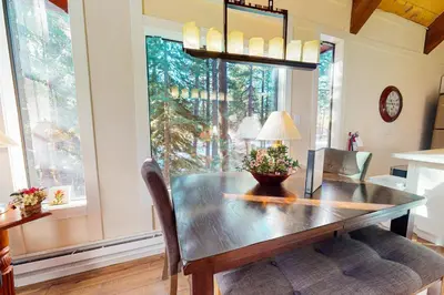 a dining room with a wooden table and a window at Double Suite Diamond Retreat in Incline Village