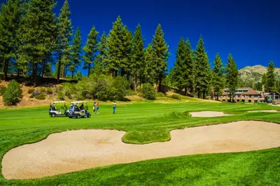 a golf course with two golf carts on a green at Double Suite Diamond Retreat in Incline Village