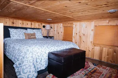 a bedroom with a bed in a wooden room at Near Ski, Beaches, Pet Friendly, Full kitchen in South Lake Tahoe