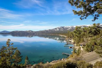 a view of a lake with mountains in the background at Vintage Tahoe Chic at Incline Village in Incline Village