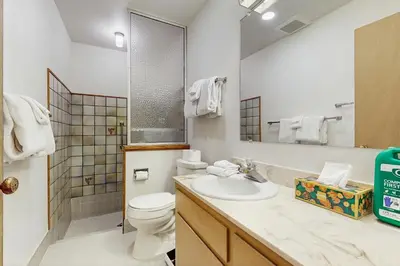 a bathroom with a sink and a toilet and a mirror at Vintage Tahoe Chic at Incline Village in Incline Village