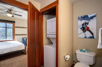 a bathroom with a bed and a toilet in a room at 3BR Condo in Village at Palisades - Premier in Olympic Valley