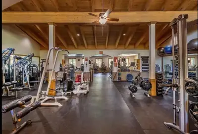 a gym with several treadmills and machines at Northstar Nest in Truckee