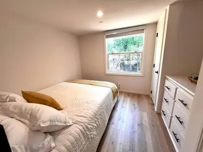 a small bedroom with a bed and a window at Bright Modern Tiny Retreat with Yoga Dome Near Yosemite, Groveland, California in Groveland