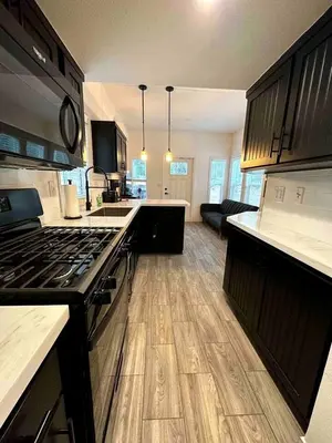 a kitchen with a stoveasteryasteryasteryasteryasteryasteryasteryasteryasteryasteryastery at Charming Bright Tiny Home with Stargazing & Yoga Dome Near Yosemite, Groveland, California in Groveland
