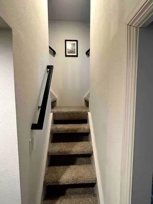 a staircase in a house with a stair case at Charming Bright Tiny Home with Stargazing & Yoga Dome Near Yosemite, Groveland, California in Groveland