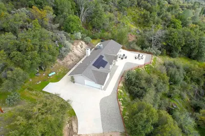 an overhead view of a house in the woods at Twilight Villa,Hot Tub,EV Charger,Yosemite and Bass lake in Oakhurst