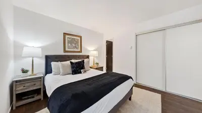 a bedroom with a large bed and a large window at Pinecone Peak by AvantStay Incline Village Condo Fireplace Balconies Pool Access in Incline Village