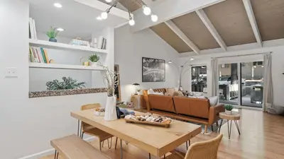 a living room with a table and a couch at Les Roes by AvantStay Incline Village Retreat • Near Lake Tahoe Beaches and Scenic Trails Diamond Peak and Local Hot Spots in Incline Village