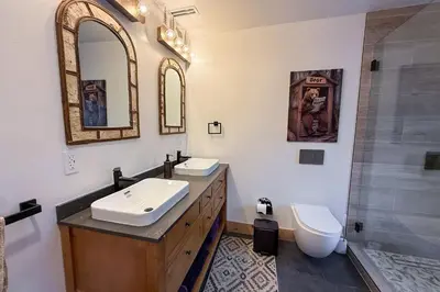 a bathroom with a sink and a toilet and a shower at Lazy Bear Manor in South Lake Tahoe