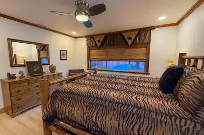 a bedroom with a bed and a window at Lazy Bear Manor in South Lake Tahoe