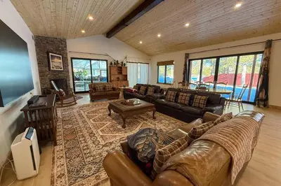 a living room with a couch and a table at Lazy Bear Manor in South Lake Tahoe