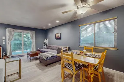 a living room with a table and a couch at Whispering Pines Retreat in South Lake Tahoe
