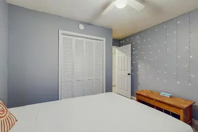 a bedroom with a large bed and a window at Whispering Pines Retreat in South Lake Tahoe