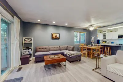 a living room with a couch and a table at Whispering Pines Retreat in South Lake Tahoe