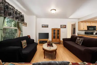 a living room with two couches and a coffee table at Mountain Paradise- Family Cabin w Pool Table in Shaver Lake