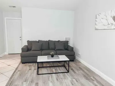a living room with a couch and a coffee table at Cozy 2 bedroom 2 baths home in North Highlands