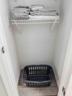 a laundry room with a basket on a shelf at Cozy 2 bedroom 2 baths home in North Highlands