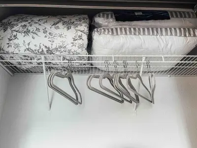 a shelf with hangers and pillows in a closet at Cozy 2 bedroom 2 baths home in North Highlands
