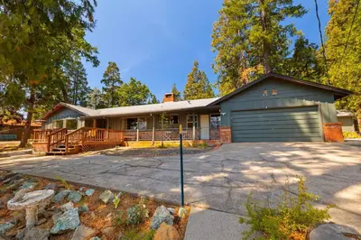 a house with a garage and a driveway at Mountain View House in Mi-Wuk Village