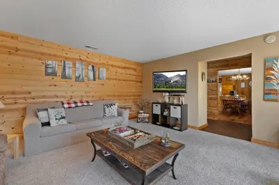 a living room with a couch and a table at Mountain View House in Mi-Wuk Village