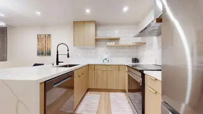 a kitchen with a sink and a refrigerator at St, Moritz 34 Cozy Centrally Located Condo With Great Complex Amenities condo in Mammoth Lakes