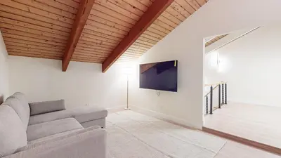 a living room with a couch and a flat screen tv at St, Moritz 34 Cozy Centrally Located Condo With Great Complex Amenities condo in Mammoth Lakes
