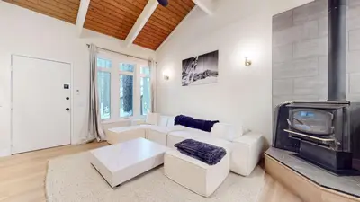a living room with a white couch and a fireplace at St, Moritz 34 Cozy Centrally Located Condo With Great Complex Amenities condo in Mammoth Lakes