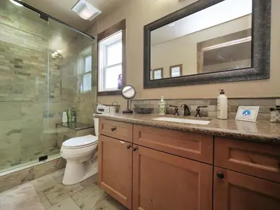 a bathroom with a toilet and a sink and a shower at Kirkwood Mountainside Cabin Views Walk to Lifts in Kirkwood