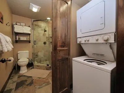 a bathroom with a washing machine and a shower at Kirkwood Mountainside Cabin Views Walk to Lifts in Kirkwood