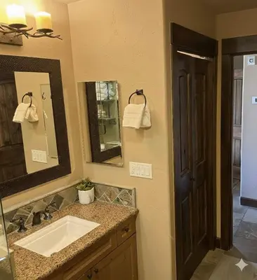 a bathroom with a sink and a mirror at Kirkwood Mountainside Cabin & Cottage Deck wViews in Kirkwood