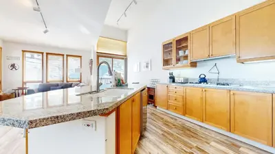 a kitchen with wooden cabinets and a counter top at Snowcreek V #777 condo in Mammoth Lakes