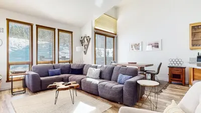 a living room with a couch and a table at Snowcreek V #777 condo in Mammoth Lakes