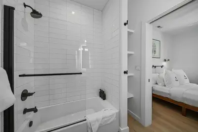 a bathroom with a shower and a bath tub at Donner Summit - Hot Tub, Fireplace & Mountain Views in Soda Springs
