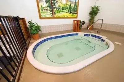 a jacuzzi tub in a living room with at The Meadows-Cozy Family Condo in Kirkwood Deck in Kirkwood