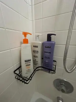 a rack with three bottles ofodorizers on a bathroom wall at The Meadows- Charmed Hotel Unit Steps to Ski Lifts in Kirkwood