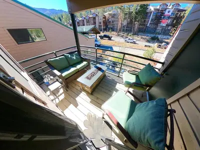 a balcony with chairs and a couch and a table at The Meadows - 2 Bdrm Family Condo in Kirkwood in Kirkwood