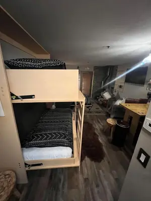 a room with two bunk beds and a desk at Kirkwood Studio SKI IN Walk out in Kirkwood