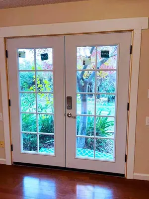 a door with two windows in a room at Tranquil 1BR Haven Peaceful Stay in Prime Clovis in Clovis