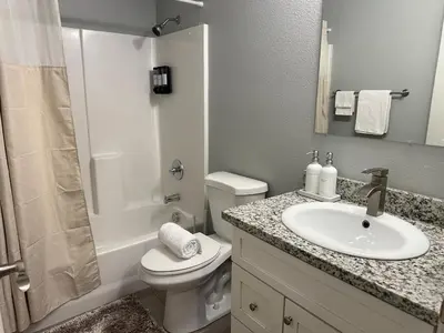a bathroom with a sink and a toilet and a shower at Cozy 3 Bedroom Walk to UC Davis Medical Near Midtown in Sacramento