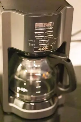 a coffee pot sitting on top of a coffee mug at Ski in or Walk to lifts hot tub covered parking in Kirkwood