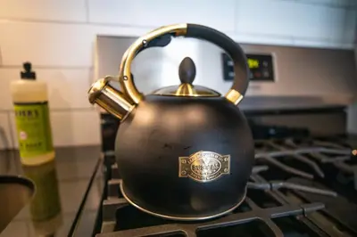 a tea kettle sitting on top of a stove at Walk to the lifts hot tub covered parking luxury in Kirkwood