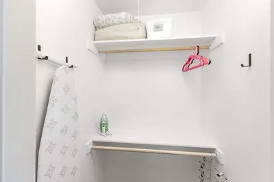 a bathroom with a towel rack and a sink at 2 bed1 bath, historic beauty, walk downtown in Visalia